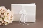 White Satin Guest Book with Pearl and Ribbon Centre image